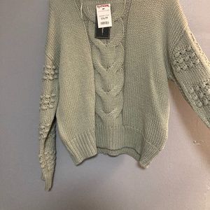 Green knitted sweater
